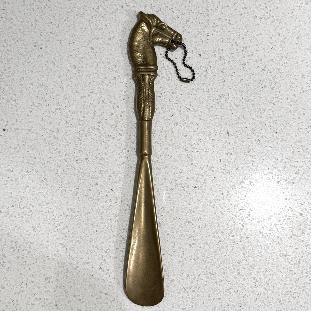 Vintage solid brass horse shoehorn